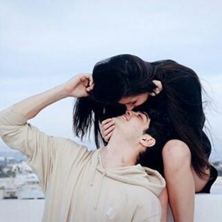 Noah Centineo in a yellowish t-shirt spending time with former lover Lauren Kolodin in black.